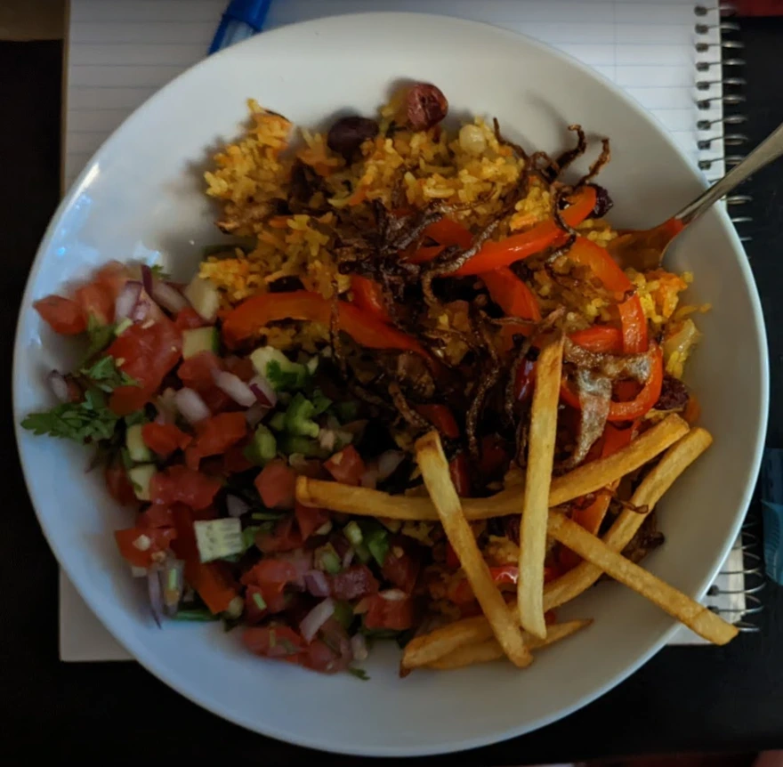 Bariis iskukaris, a Somalian rice dish. The french fries were super cute garnishes in images online but look depressing here.