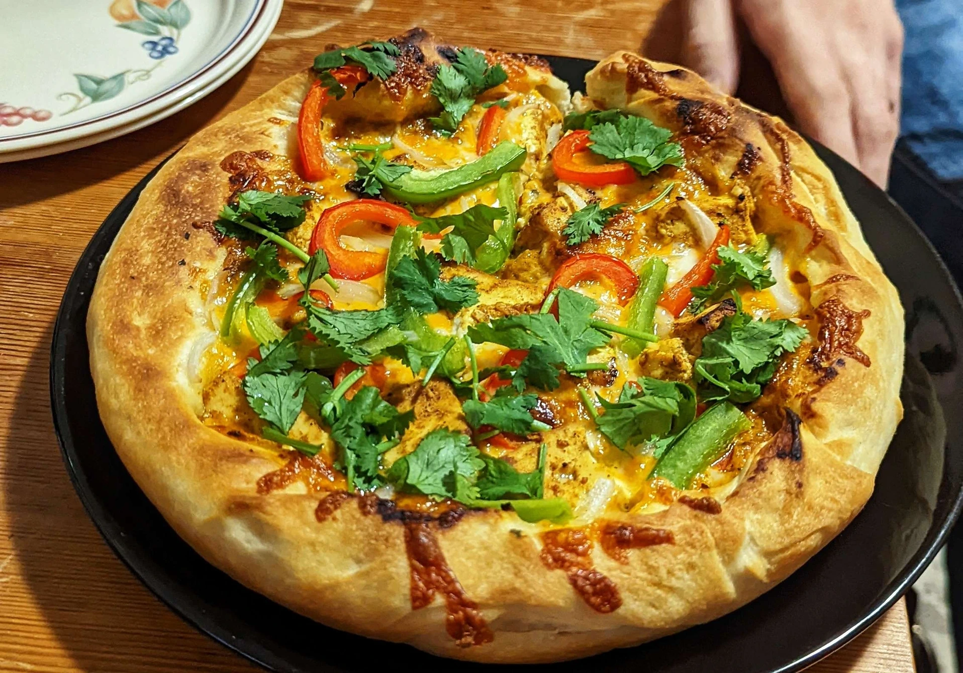 Tikka masala style pizza, homemade dough, baked in a cast iron pan.